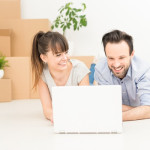 Young people move into a new apartment.