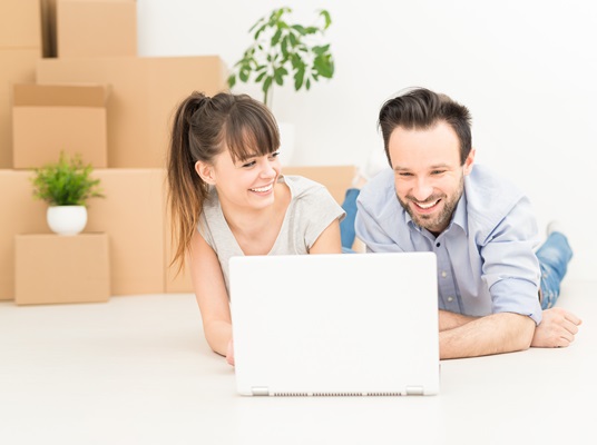 Young people move into a new apartment.
